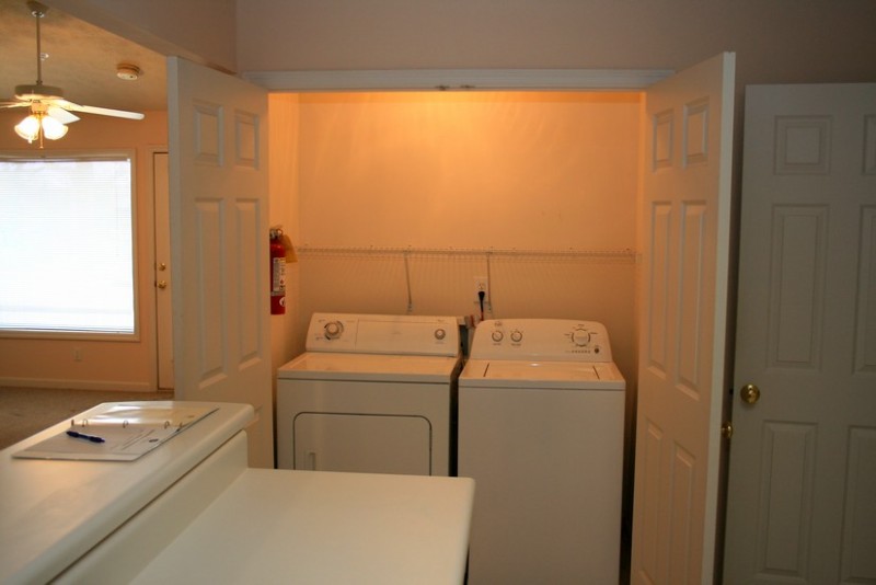 Full size washer and dryer. Nice storage above appliances. Full size washer and dryer. Nice storage above appliances.