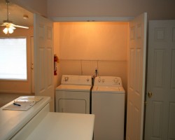 Full size washer and dryer. Nice storage above appliances.