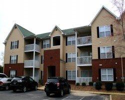 Exterior view of building. Please note unit's balcony is located on pool side not parking lot side.